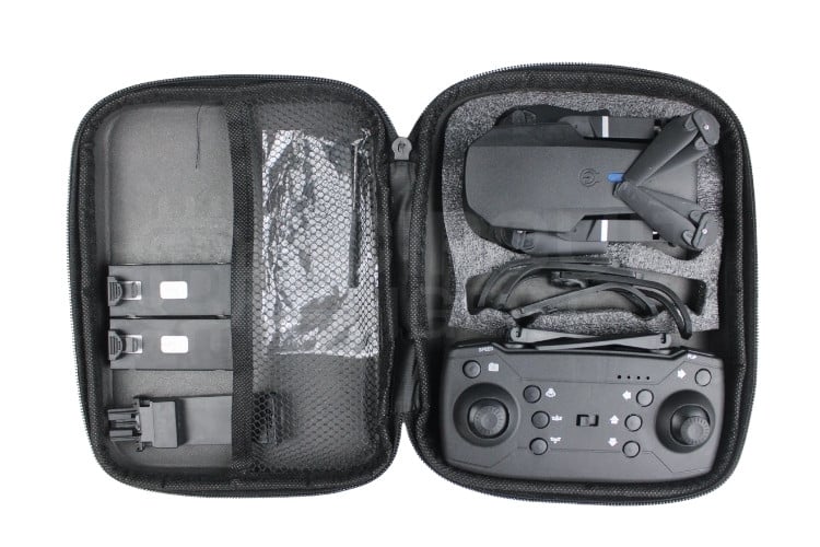 E88 drone unboxing showing complete package contents including remote controller, batteries, spare propellers, and carrying case - drone teardown preparation