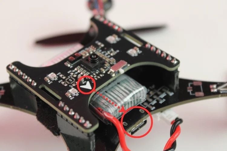 Correct installation direction of the LiteWing positioning module - arrow must face the USB-C port