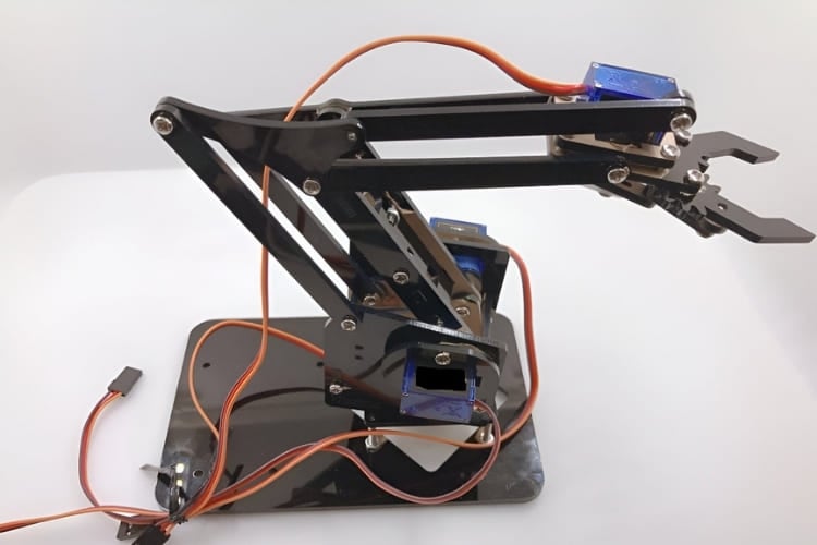 4-DOF robotic arm using ESP32 with web-based smartphone control interface for wireless operation